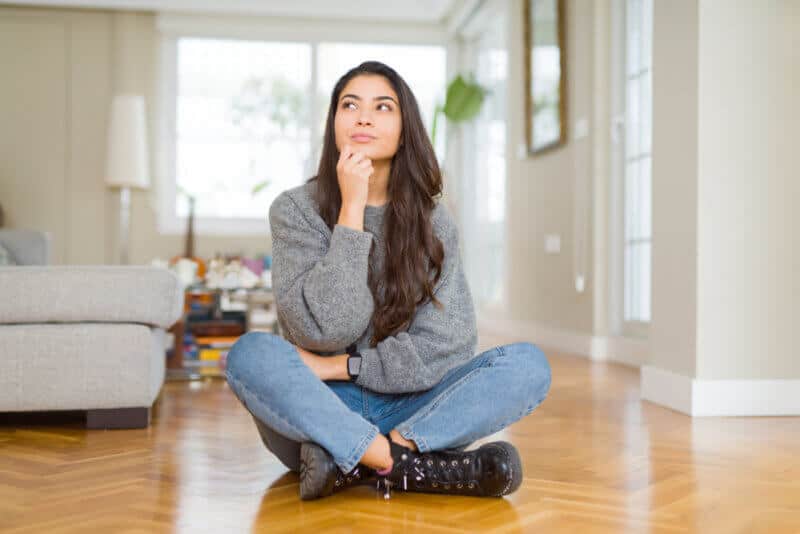 young woman in her new oregon home with renters insurance