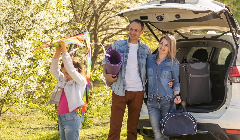 Smiling family members on a road trip in Washington