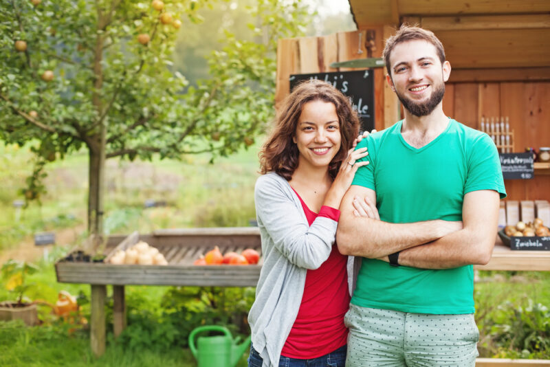 Young couple with home out in the country