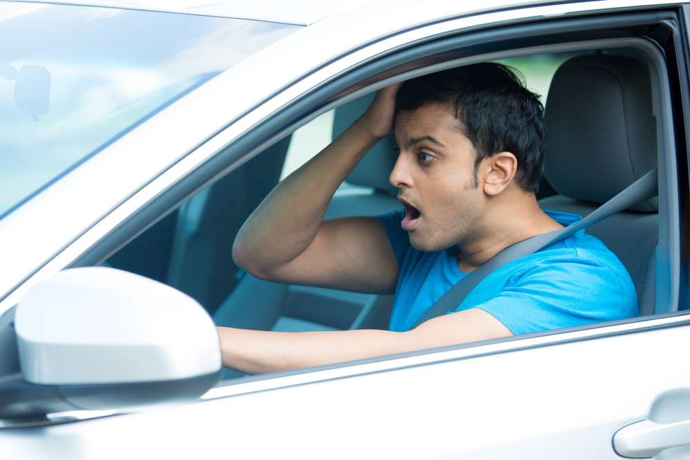 Young man behind the wheel freaking out because someone hit him and drove away - uninsured motorist coverage in Washington