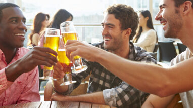 Male friends out having a beer in the bar - cheap DUI insurance in Washington