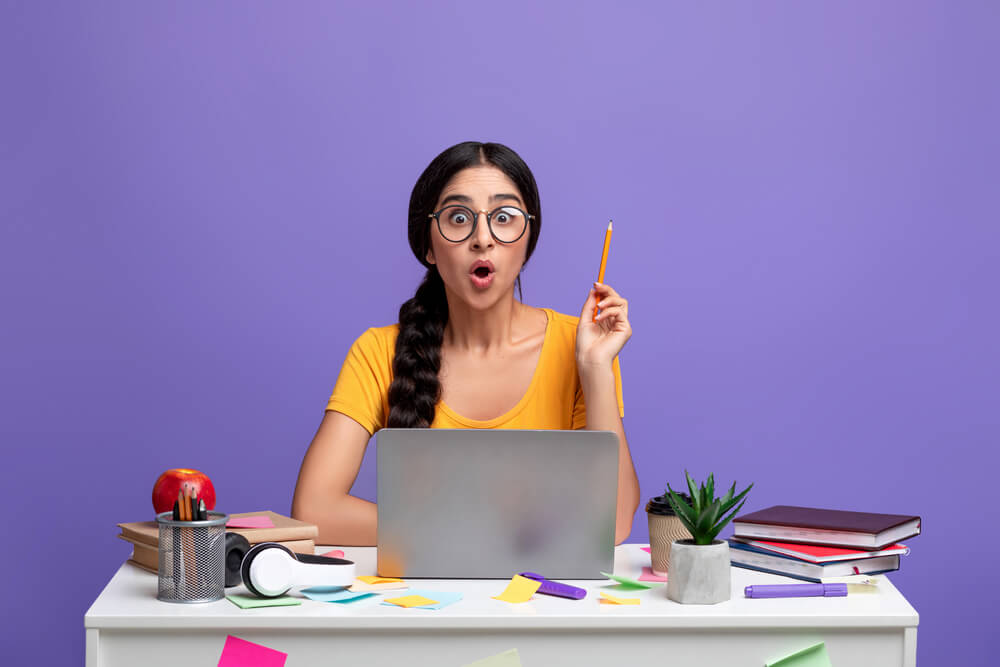 Young woman having a eureka moment of understanding with eyes wide - cheap business insurance in Washington.